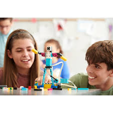 Holiday camp group of children enjoying creative and outdoor activities